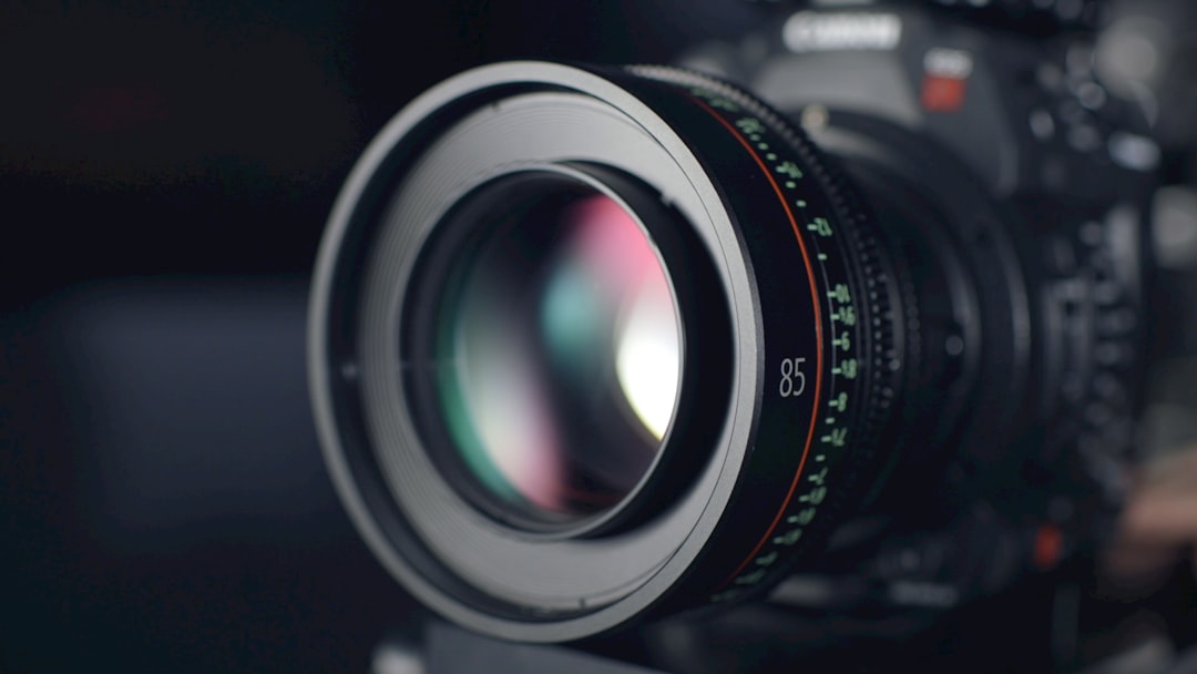 Close-up of a camera lens with a blurred background